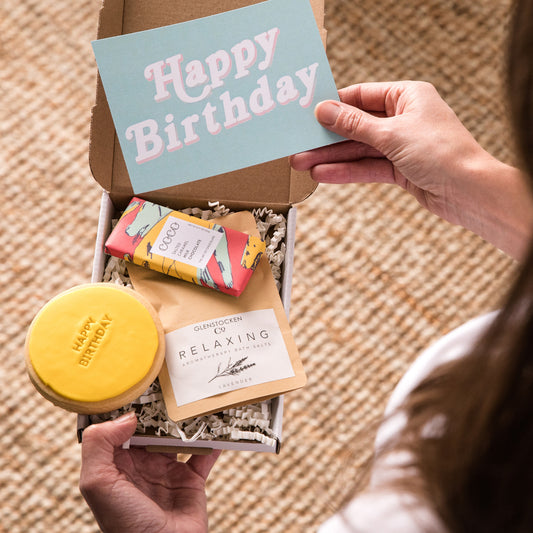 Happy Letterbox Gift Co. | Mini Birthday Gift Box. Included in our mini birthday gift box are artisan milk chocolate, relaxing bath salts in Lavnder and a bright Happy Birthday cookie, all in our letterbox friendly gift boxes with a gift card with we can add a hand written message to for you.